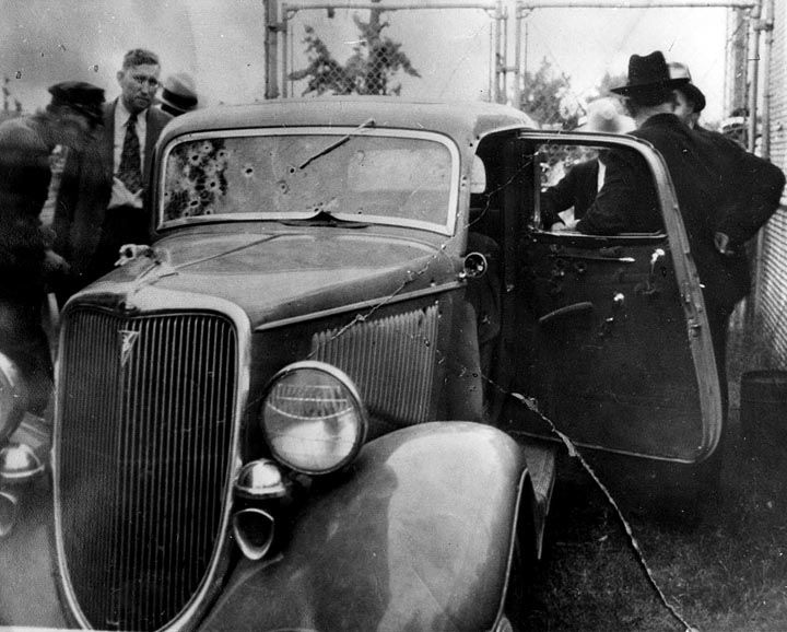 Date: unknown Creator: unknown Description: Officers inspect Clyde Barrow and Bonnie Parker's bullet-riddled V8 Ford at the police impound after removing the couple's bodies. Dallas County Sheriff Smoot Schmid is at left, hatless. Contributing Partner: Dallas Municipal Archives Bonnie Parker Clyde Barrow